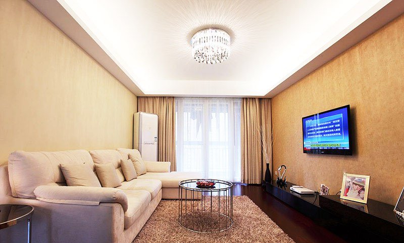 四居室大L型沙发土黄色电视墙客厅装修效果图