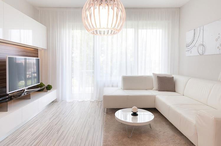 L型沙发乳白色色调一居室客厅装修效果图