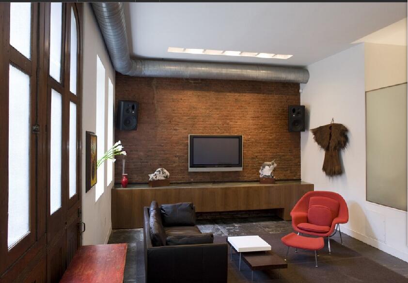 大连当代公司40平米小户型客厅砌砖电视墙方格窗户客厅红色休闲椅效果图