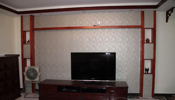 五指山天之城10平米客厅中式边条电视墙红木电视柜效果图